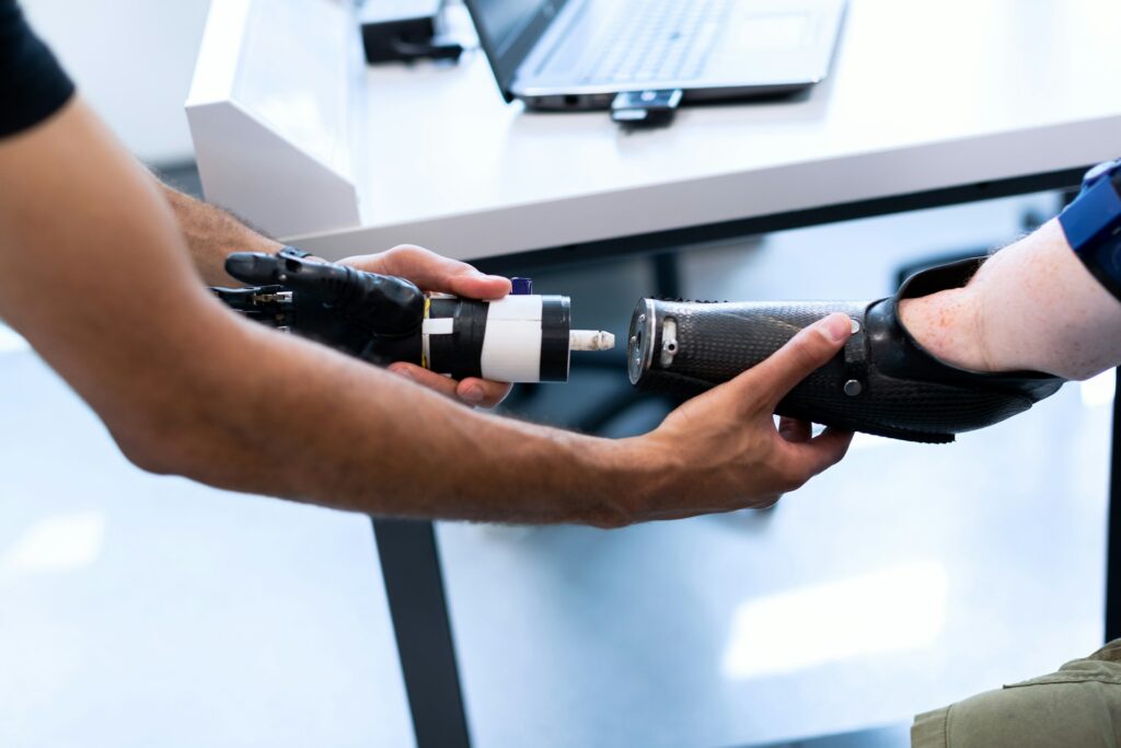 biomedical engineer examining prosthetic arm